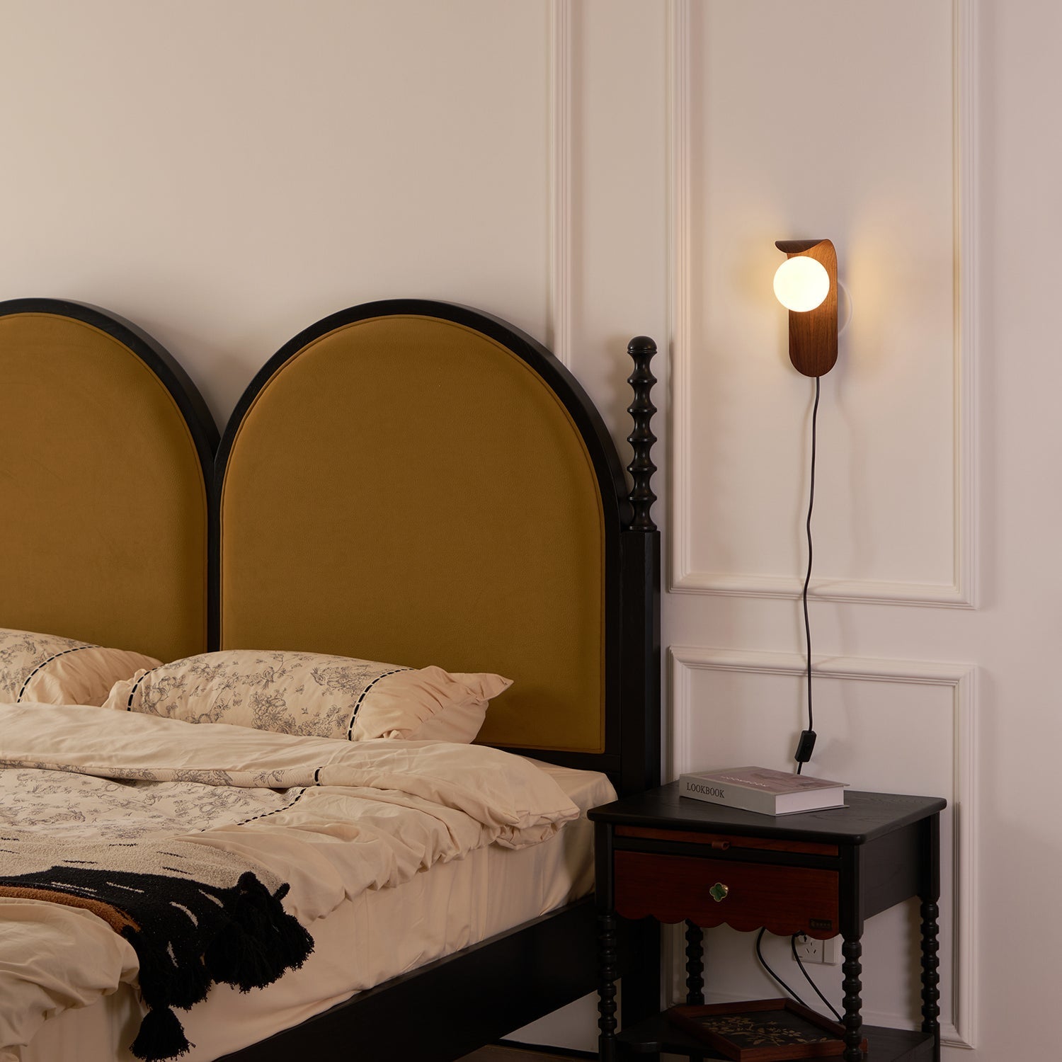 Curved Fixture and Frosted Globe Wall Lamp