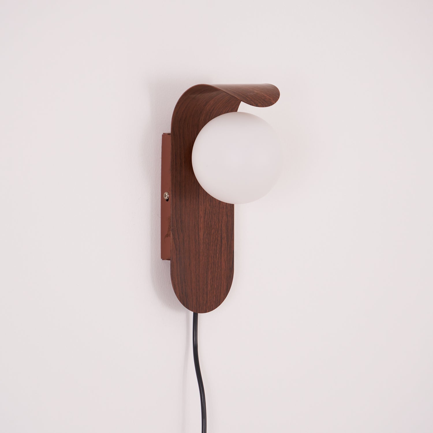 Curved Fixture and Frosted Globe Wall Lamp