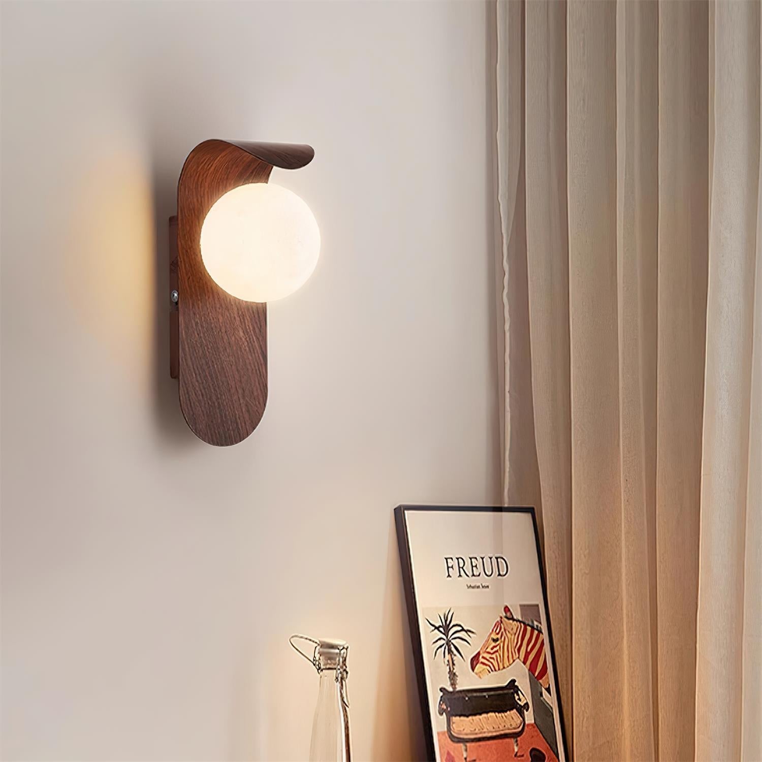 Curved Fixture and Frosted Globe Wall Lamp
